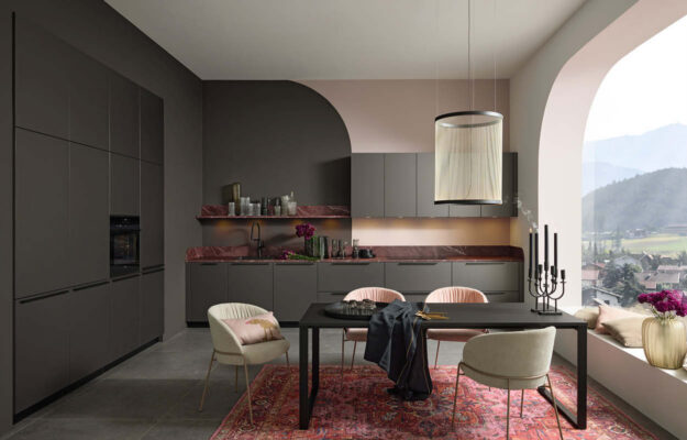 Küchen von Nolte bei VIVA Küchen – designorientierte Küche in dunklen Farbtönen mit Essbereich und Ausblick